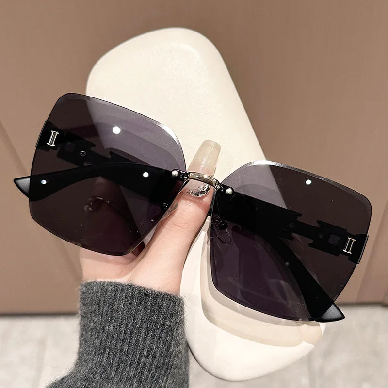 New women's anti-UV large frame sunshade versatile sunglasses frameless fashion sunglasses(DS-1019)