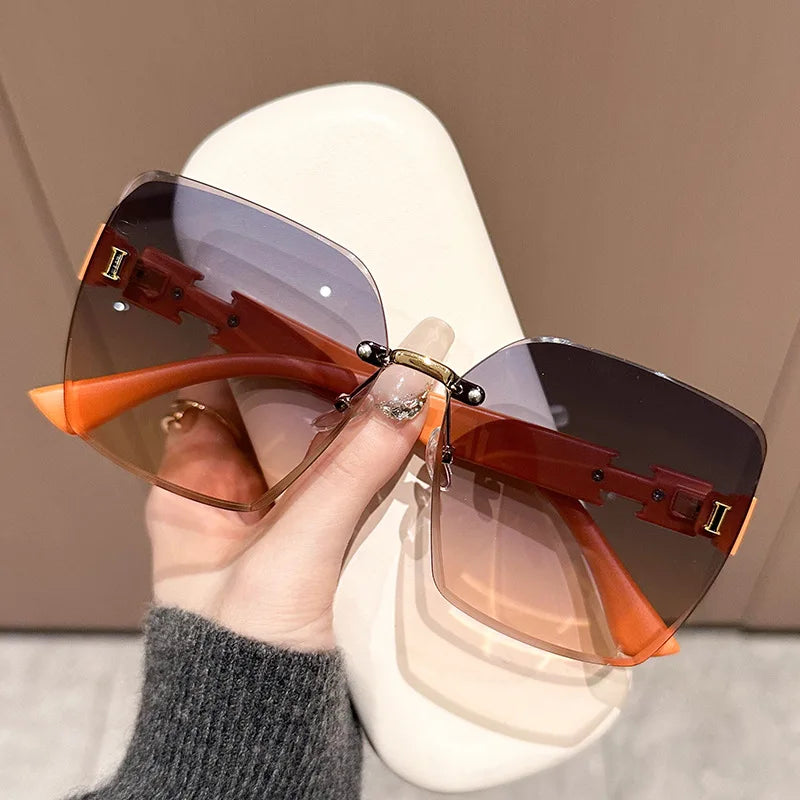 New women's anti-UV large frame sunshade versatile sunglasses frameless fashion sunglasses(DS-1019)